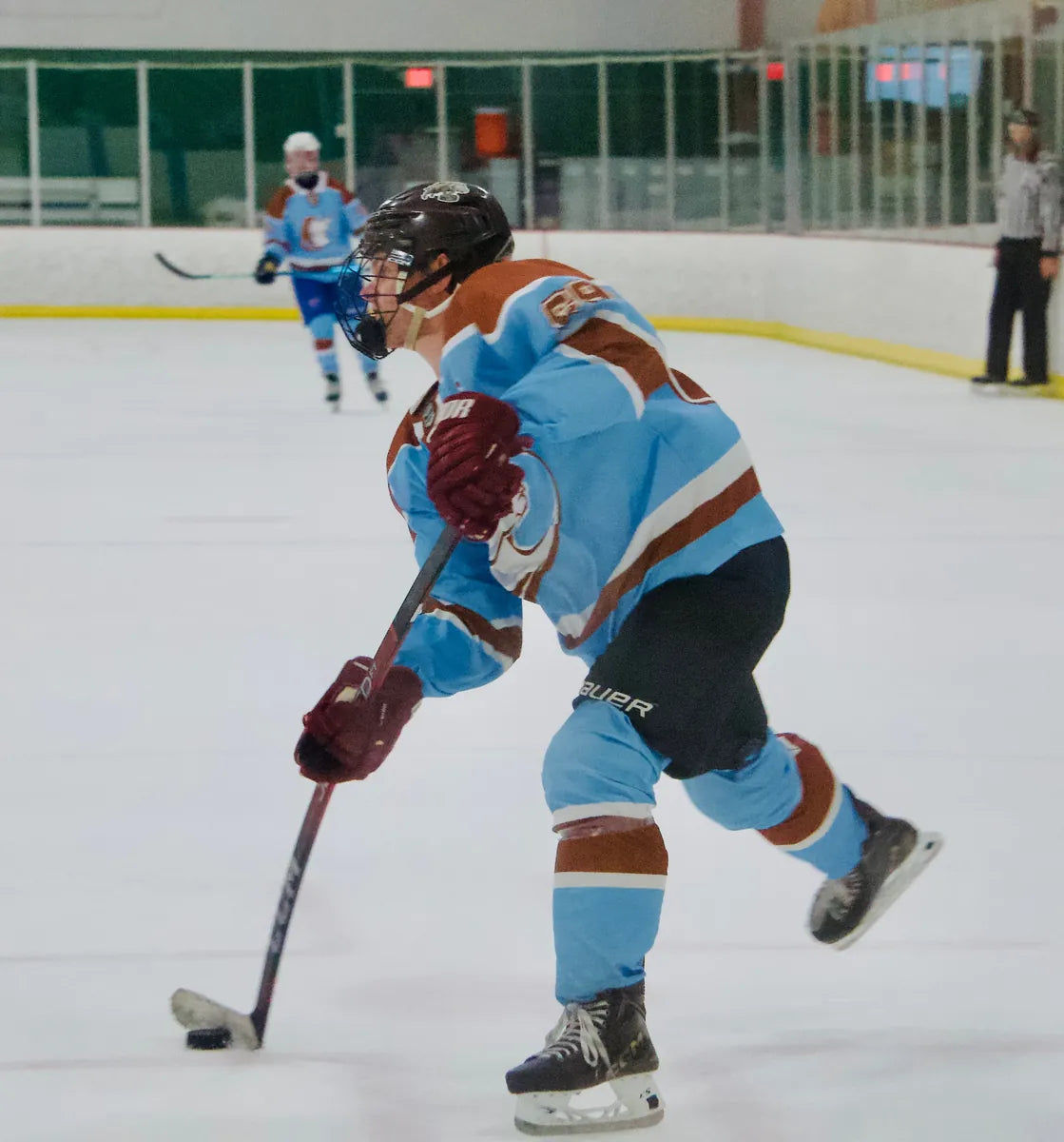 Austin Wranglers player taking a shot in a light blue custom jersey