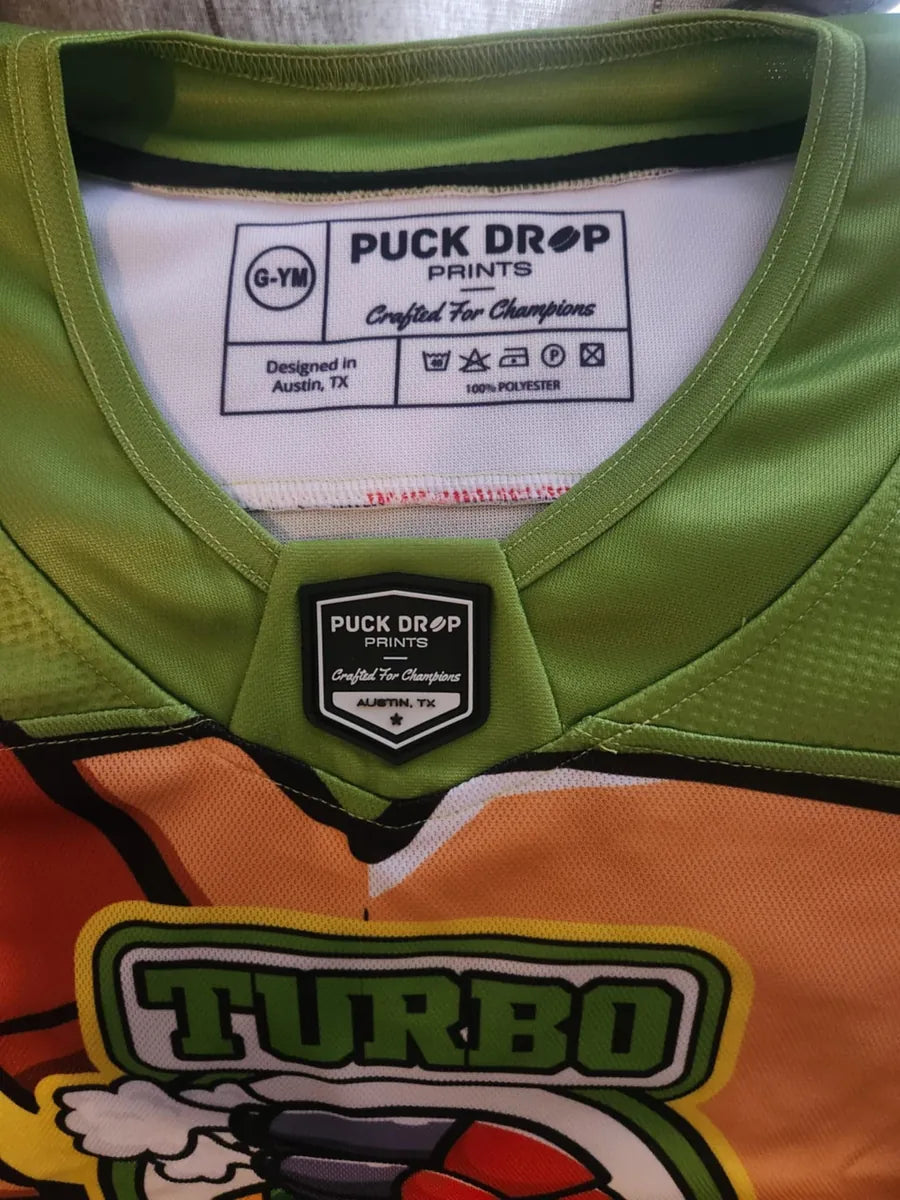 Puck Drop Prints neck tag inside a green Turbo Turtles custom jersey